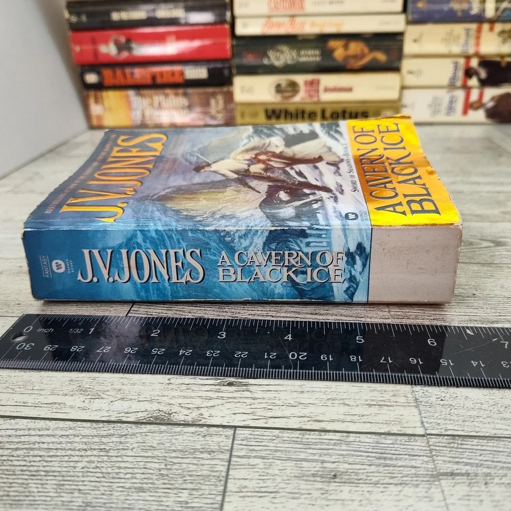 A CAVERN OF BLACK ICE JV Jones 2000 First US 11st Edition Warner Paperback‎